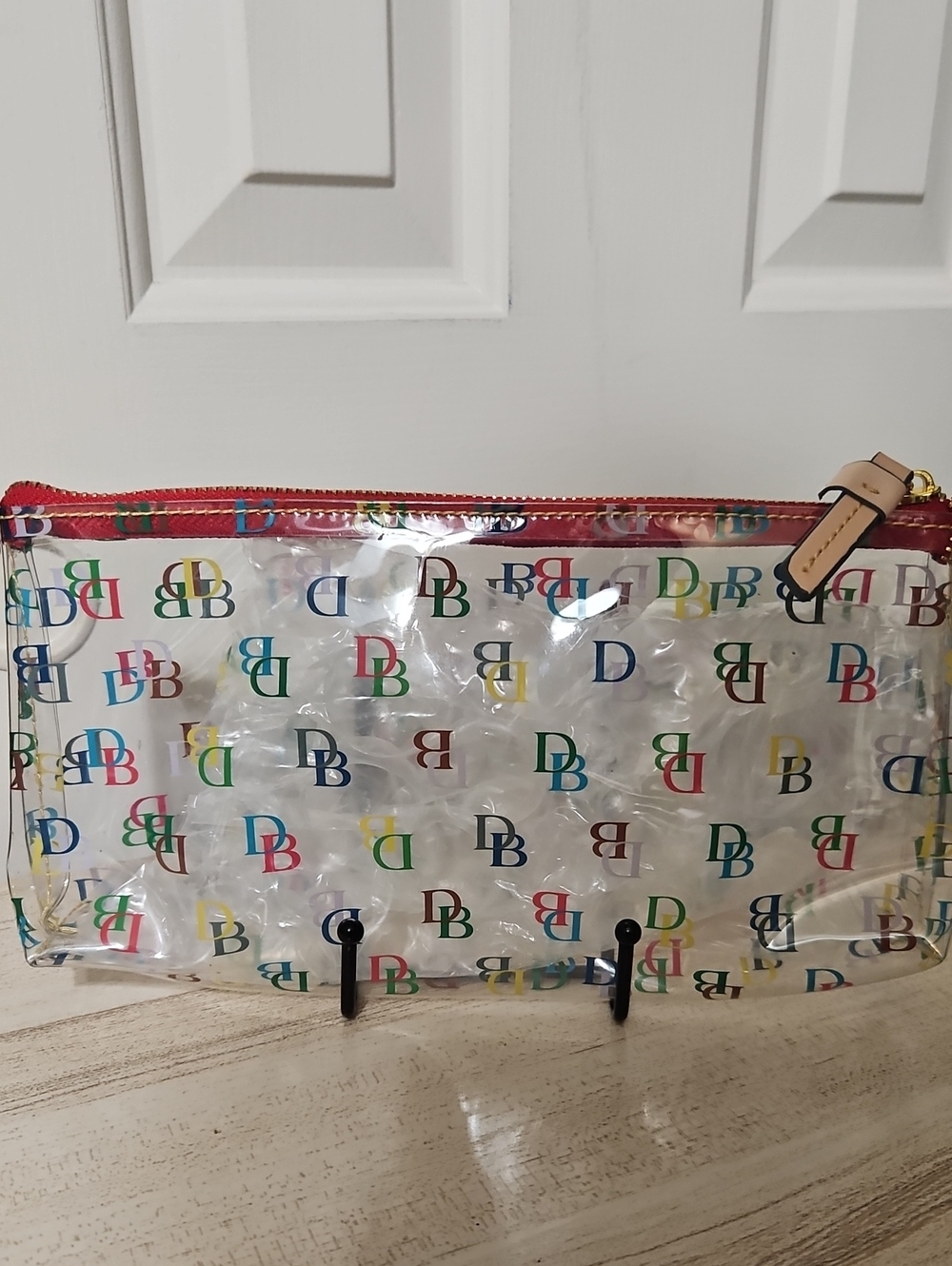 Dooney & Bourke NWOT Clear PVC Cosmetic Pouch with Multicolor DB Logo
